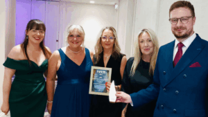 MCR Pathways team poses with their Highly Commended Award at the Fife Business Awards.
