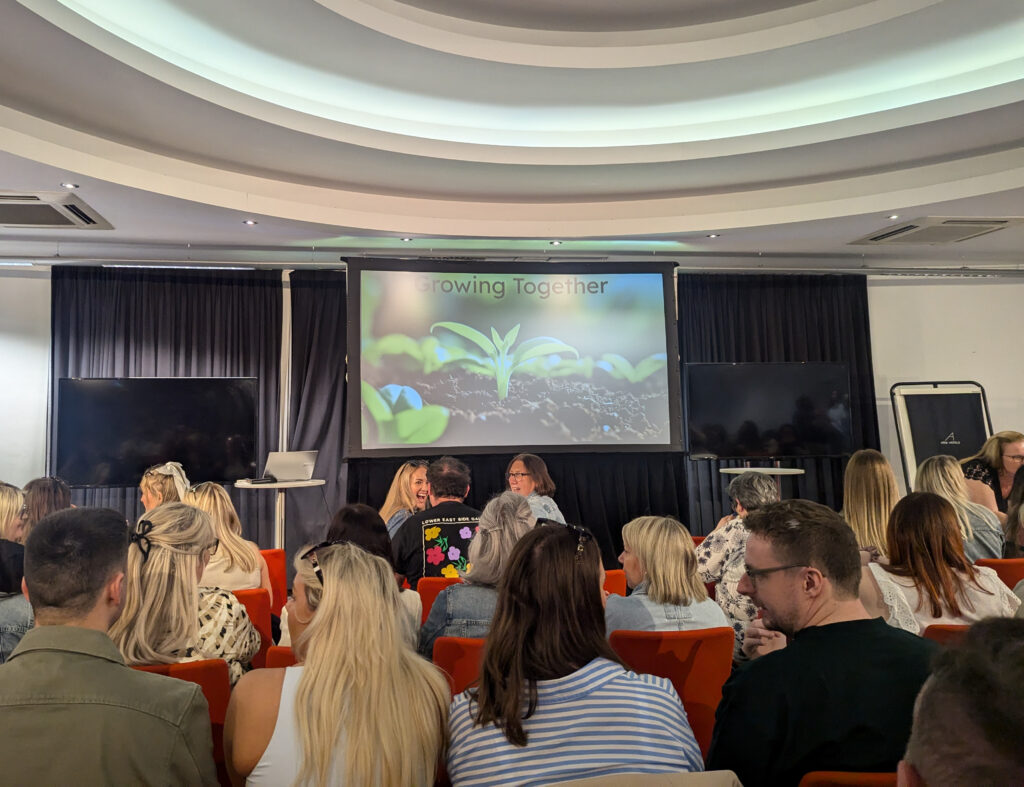 The image shows the heading of a slideshow, with a photo of growing buds behind the text 'growing together'.